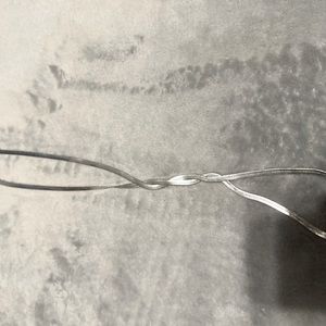 Silver herringbone necklace.